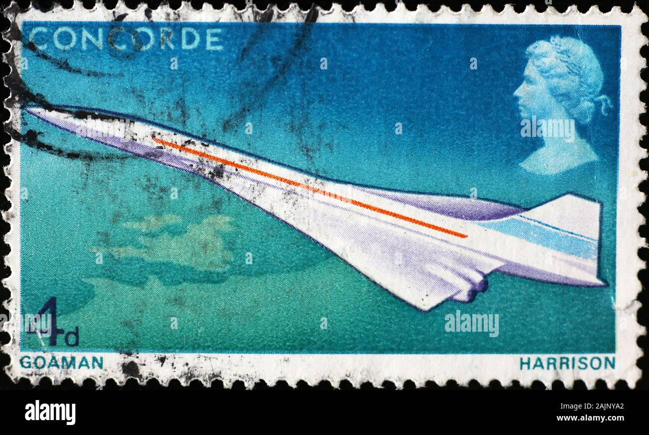 Airplane Concorde on old british stamp Stock Photo