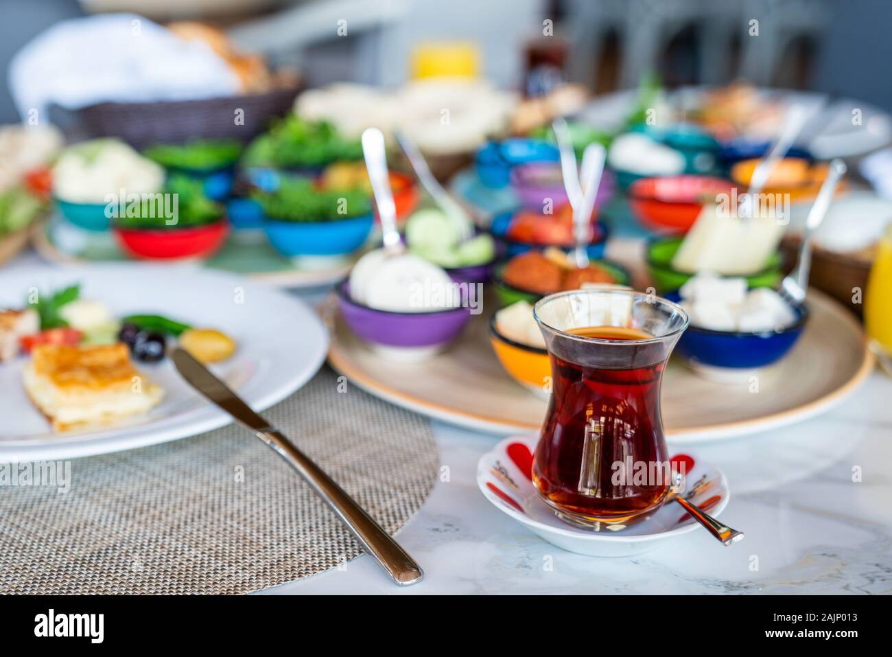 A delicious and various mediterranean breakfast with black tea. Stock Photo