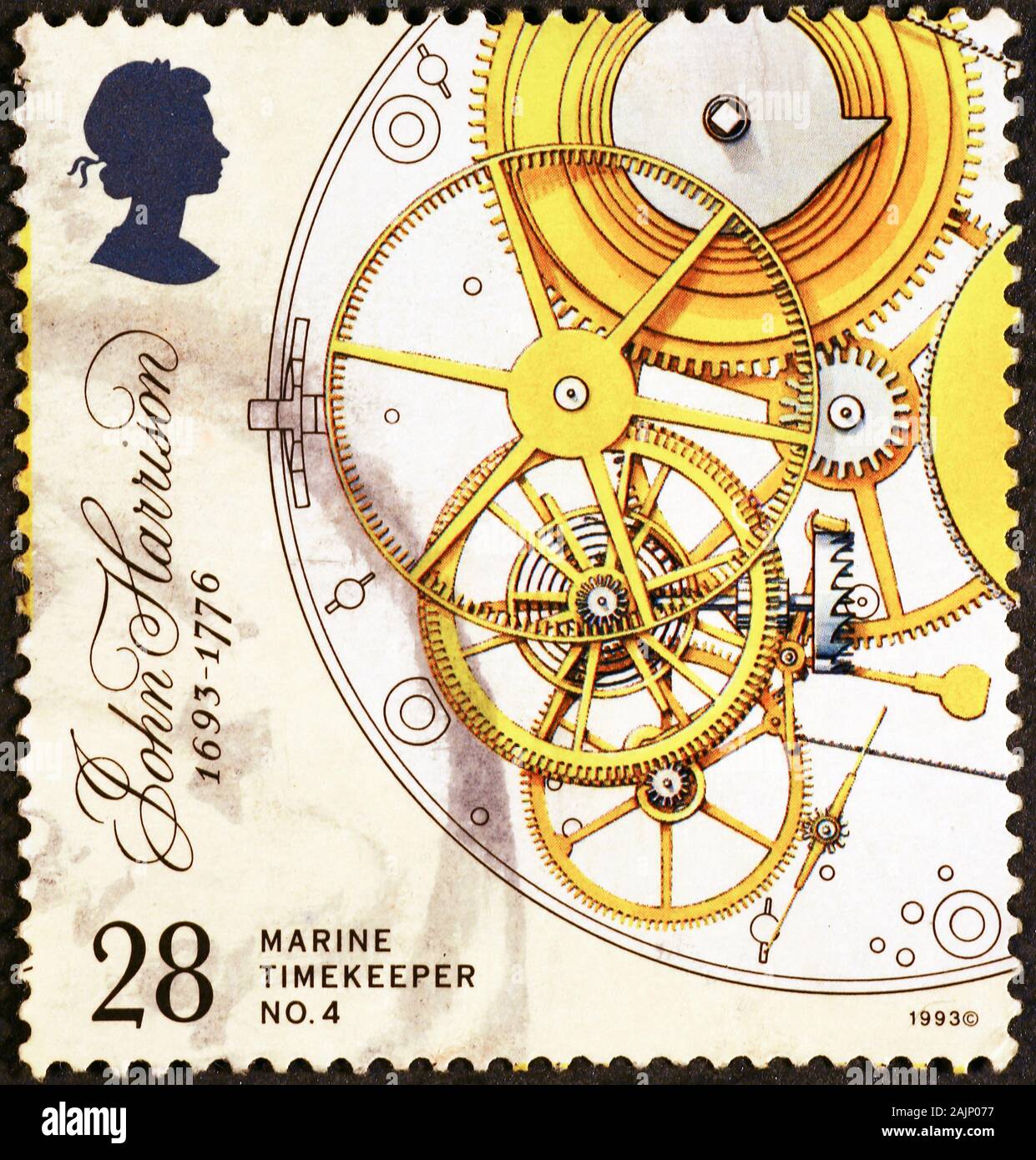 Watch gears on british postage stamp Stock Photo