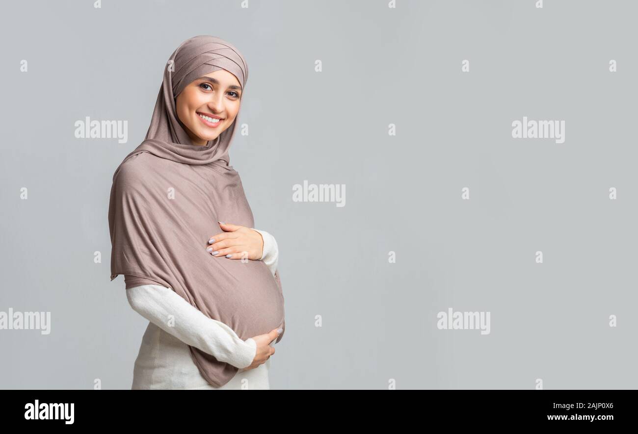 Pregnancy And Islam Concept Beautiful Pregnant Muslim Woman In Hijab