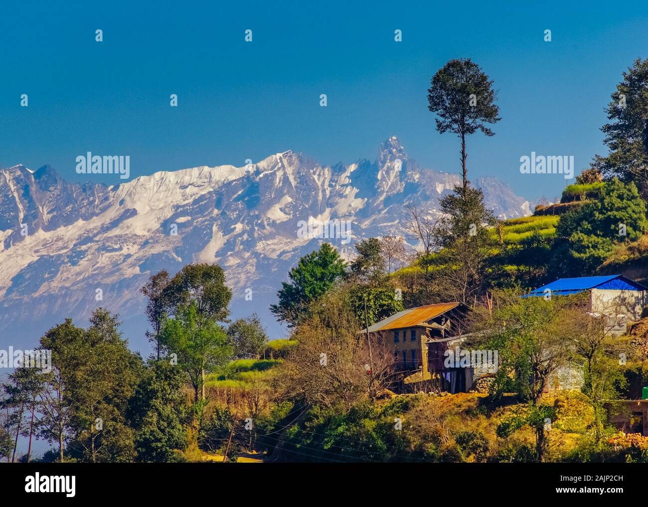 mountain range views behind terrace farms in Nagarkot, Nepal Stock Photo
