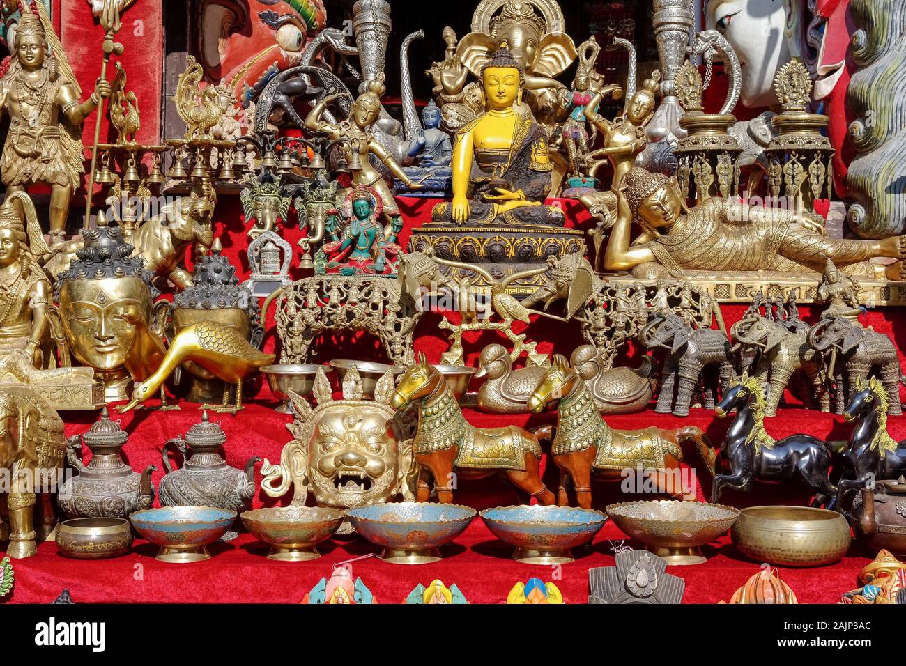 decorative brass and metal figurines and statuettes on display in Nepal market Stock Photo