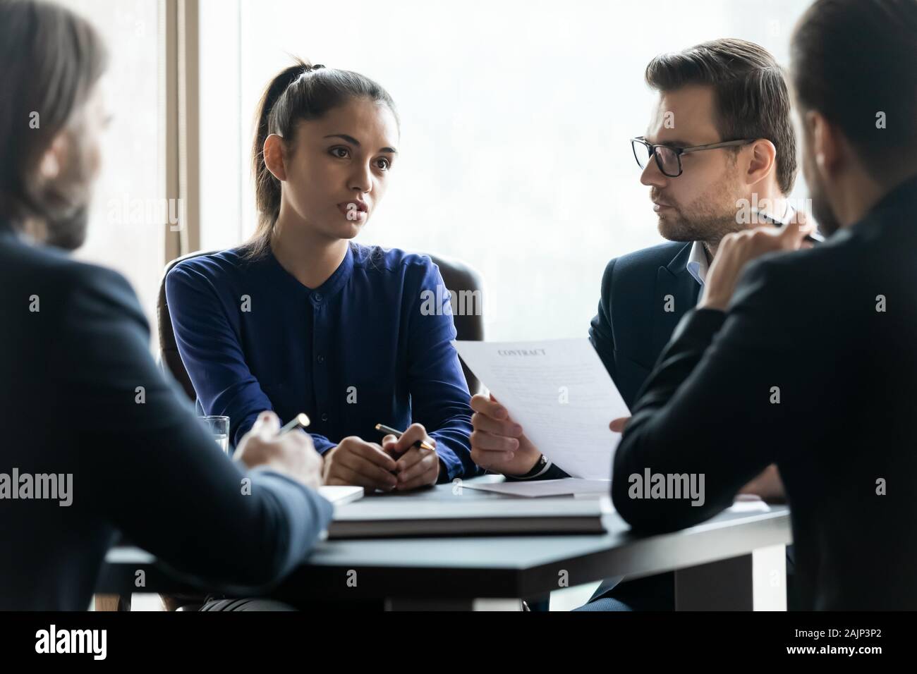 Businesspeople brainstorm discussing cooperation at office briefing Stock Photo