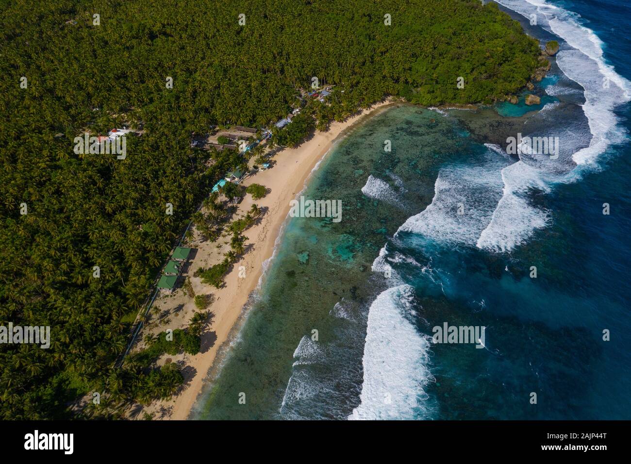 Aerial view taken with a drone of strong waves breaking onto Magpupungko beach,Siargao,Philippines Stock Photo
