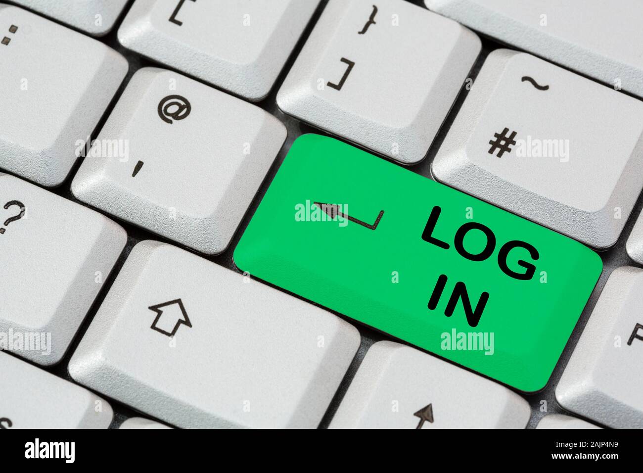 A keyboard with Log In written on a green enter key to login to a website. England, UK, Britain Stock Photo