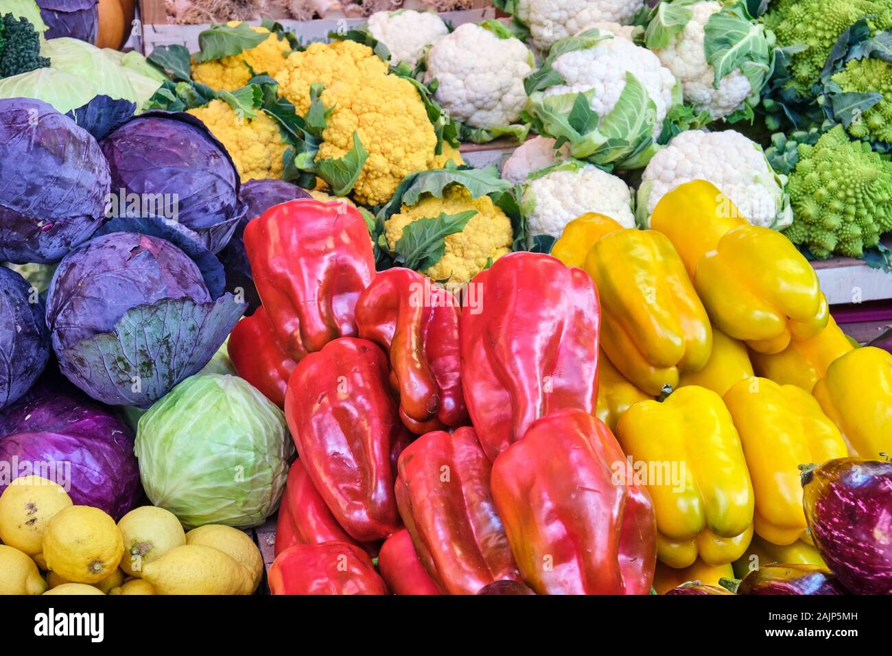 Bell pepper, cabbage and different kinds of broccoli for sale at a market in Rome Stock Photo