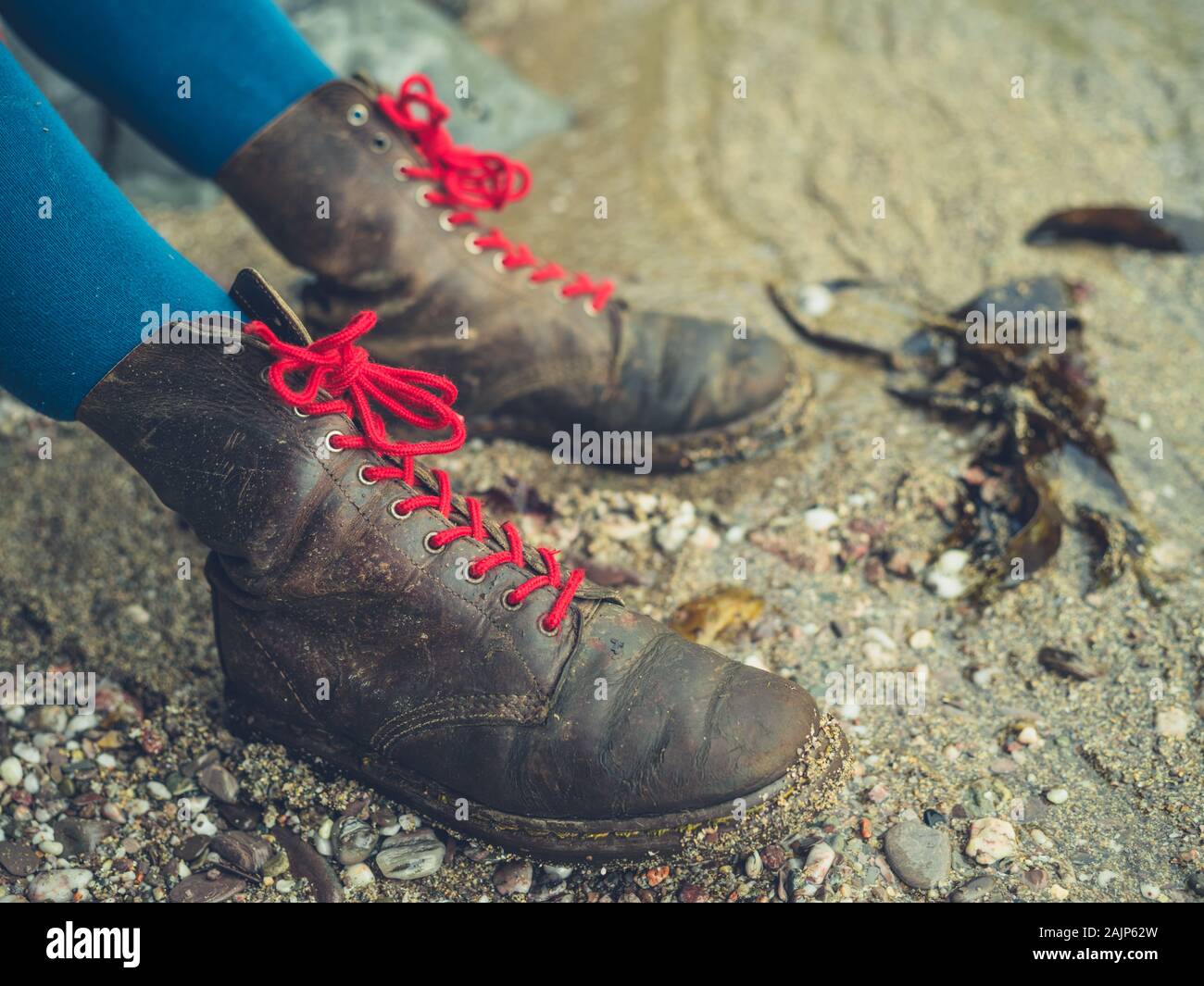 Woman wearing leather boots hi-res stock photography and images - Alamy