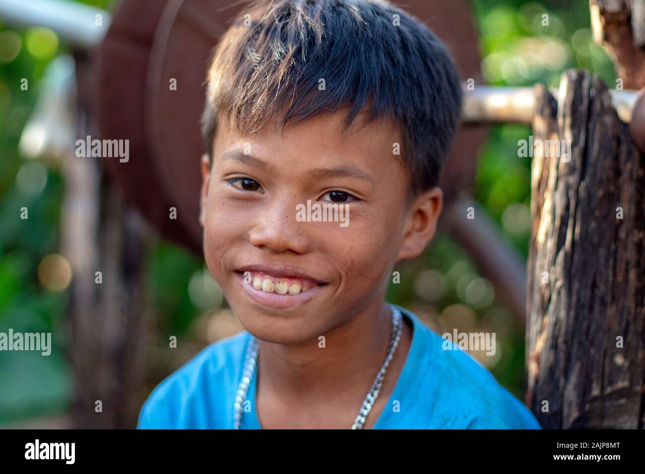 Portrait of an Asian teenager smiling Stock Photo - Alamy