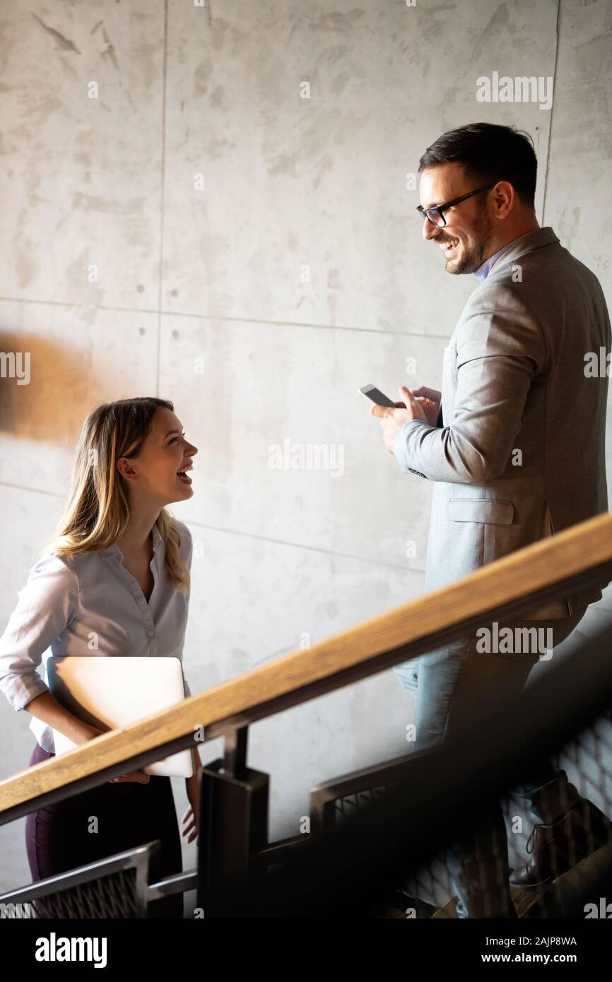 Business people having fun and chatting at workplace office Stock Photo