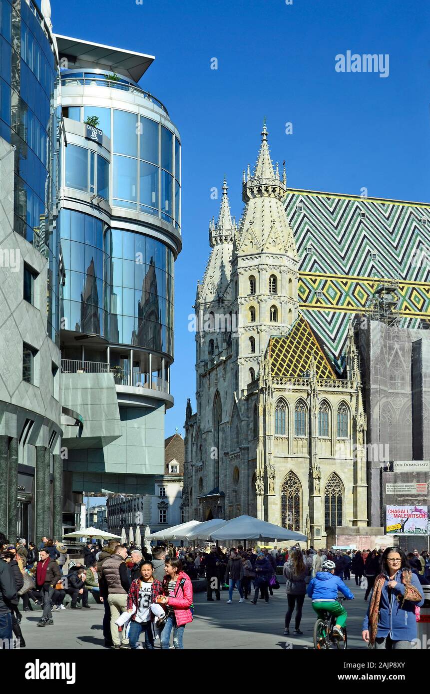 Vienna, Austria - March 27th 2016: Unidentified people on Stephansplatz with Haas Hausl and Stephansdom - church in center of the city Stock Photo