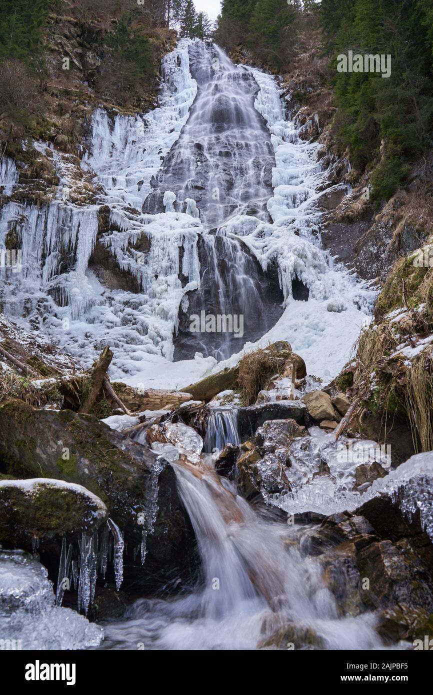 Winter landscape with mountain waterfall frozen on the edges Stock ...