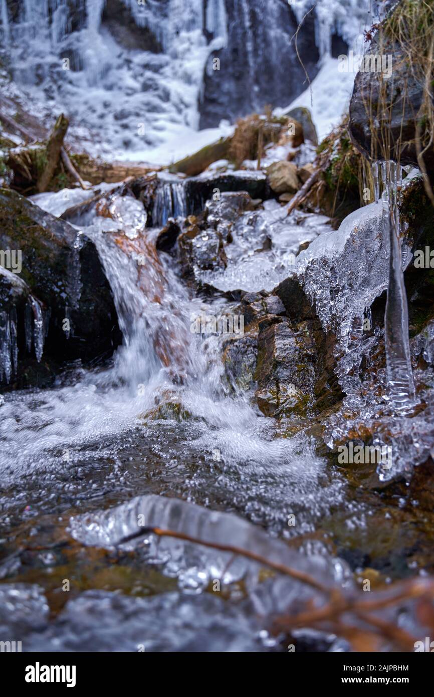 Winter landscape with mountain waterfall frozen on the edges Stock ...