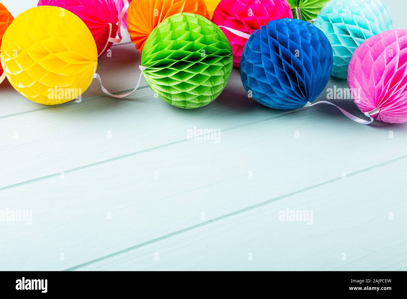 Festive background with colorful paper balls. Stock Photo