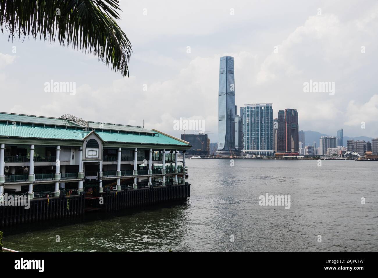The Star Ferry Pier and view of the International Commerce Center and Tim Sha Tsui District, Hong Kong Stock Photo