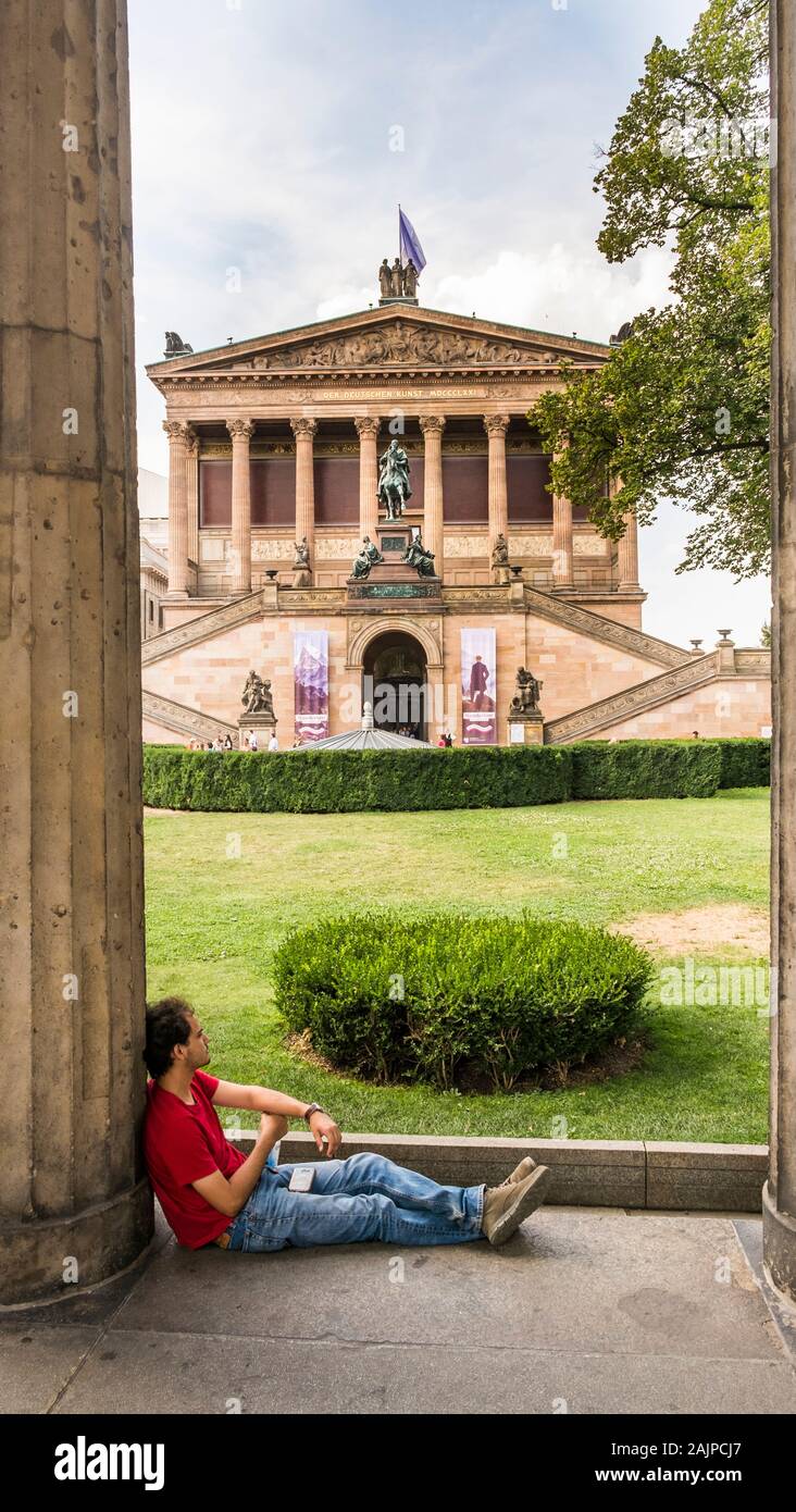 young man taking a break in the gardens of alte nationalgalerie, old national gallery Stock Photo