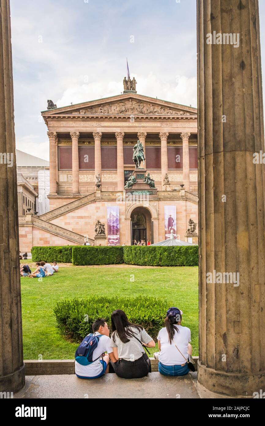 asian tourists taking a break in the gardens of alte nationalgalerie, old national gallery Stock Photo