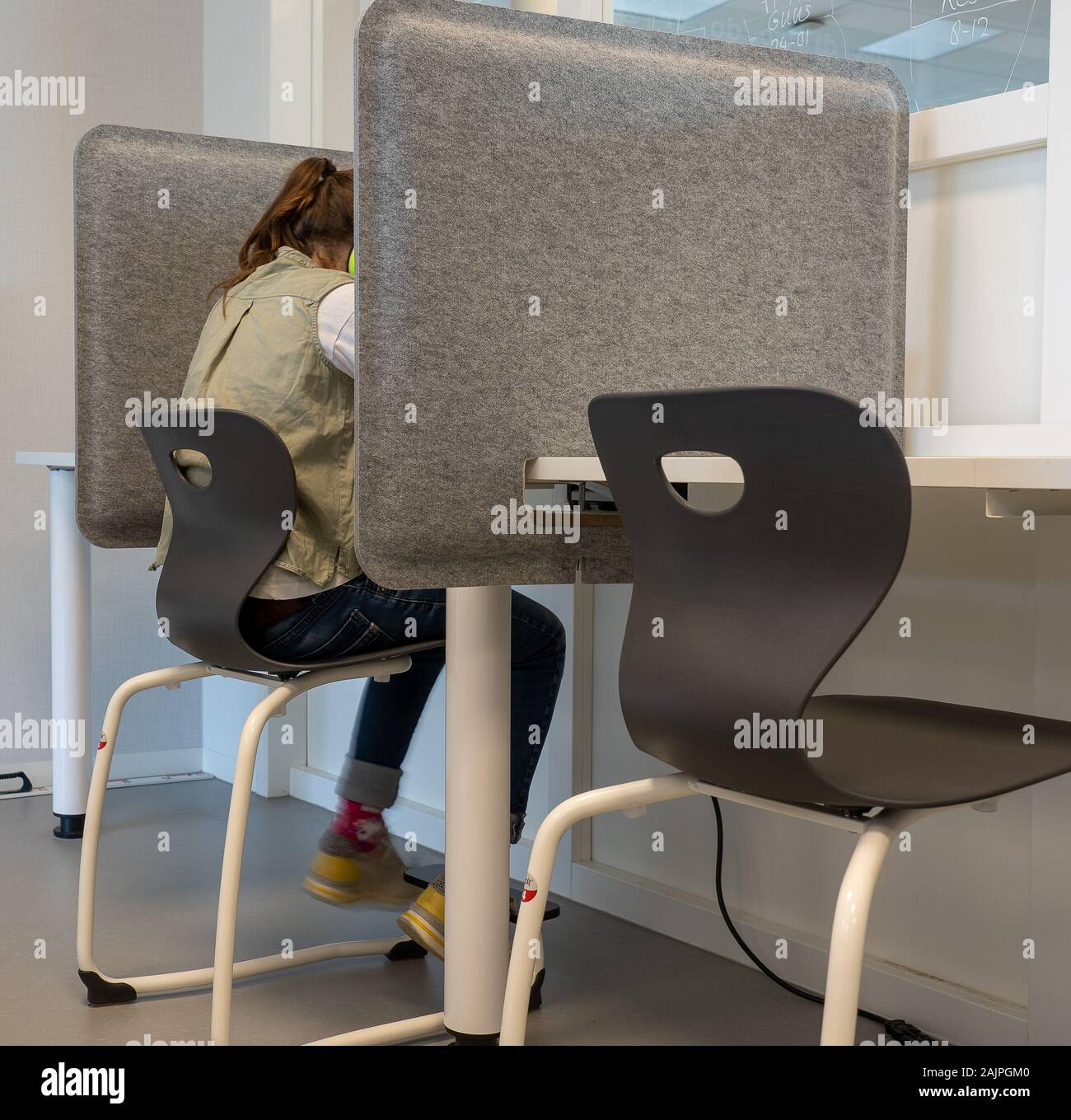 NIJMEGEN / NETHERLANDS-SEPTEMBER 13, 2019: Modern school building for children up to 12 years old. The children are busy carrying out an assignment in Stock Photo