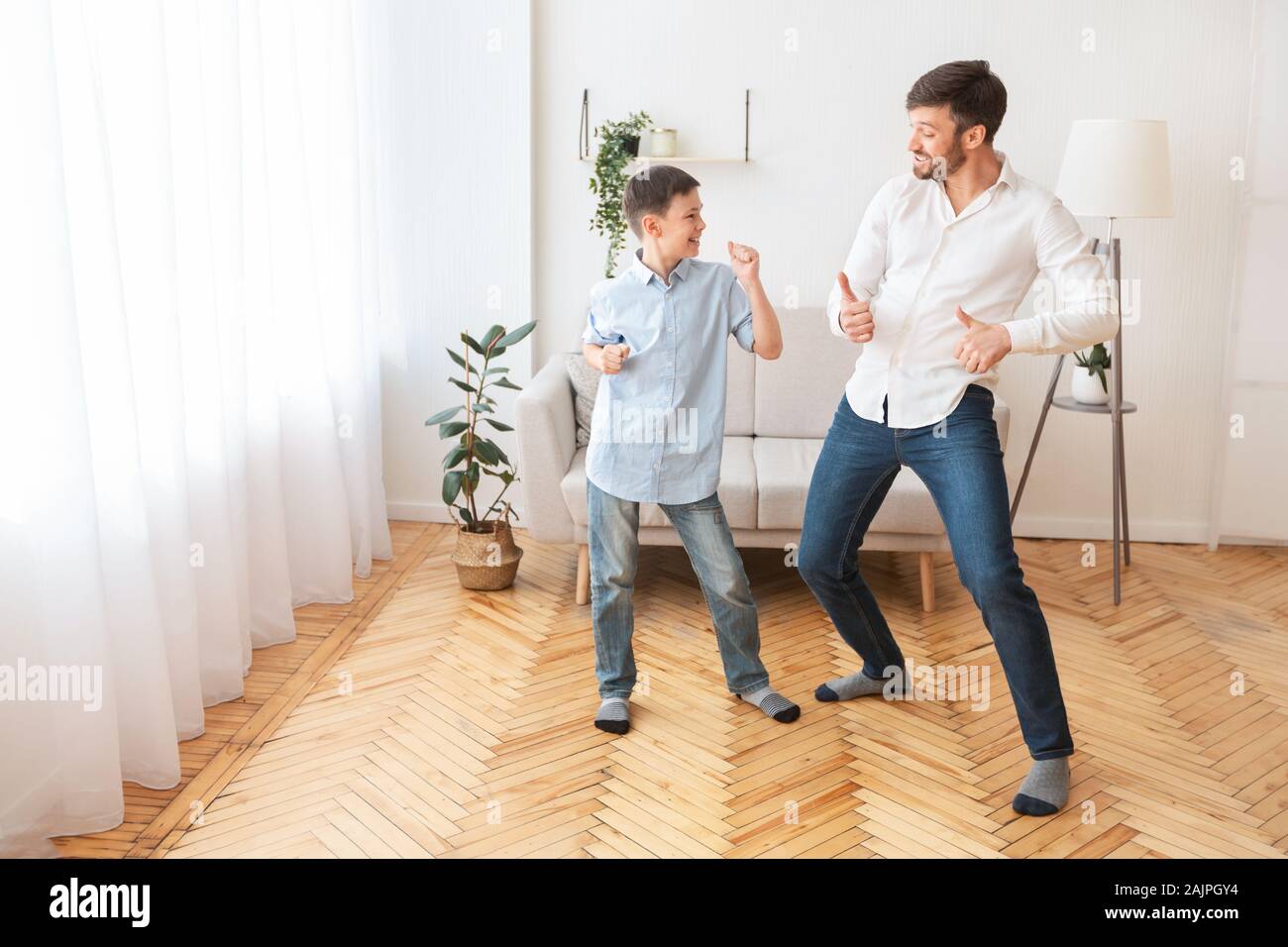 happy-father-and-son-dancing-having-fun-