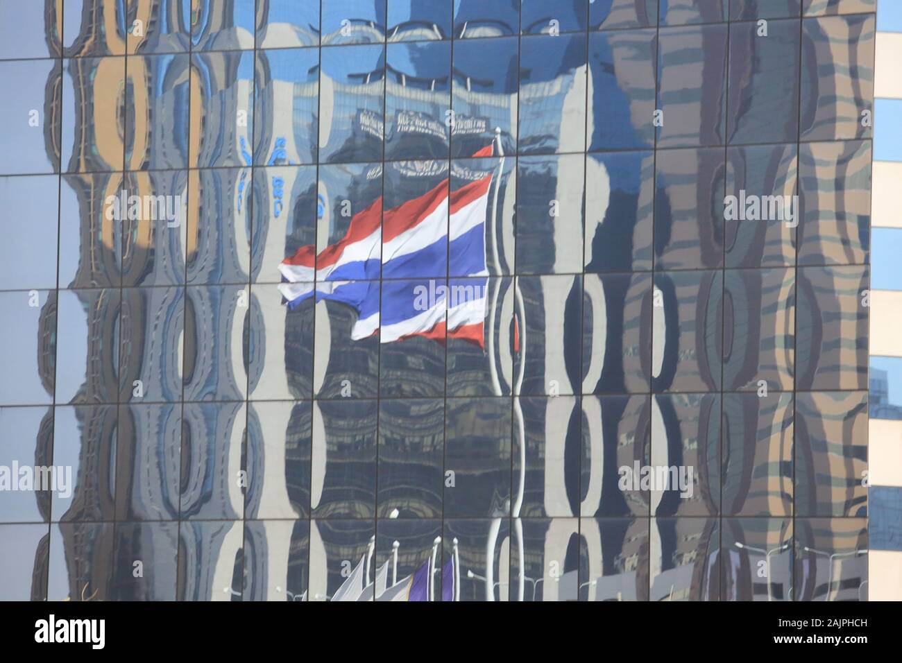 the glass building and the thailand flag Stock Photo