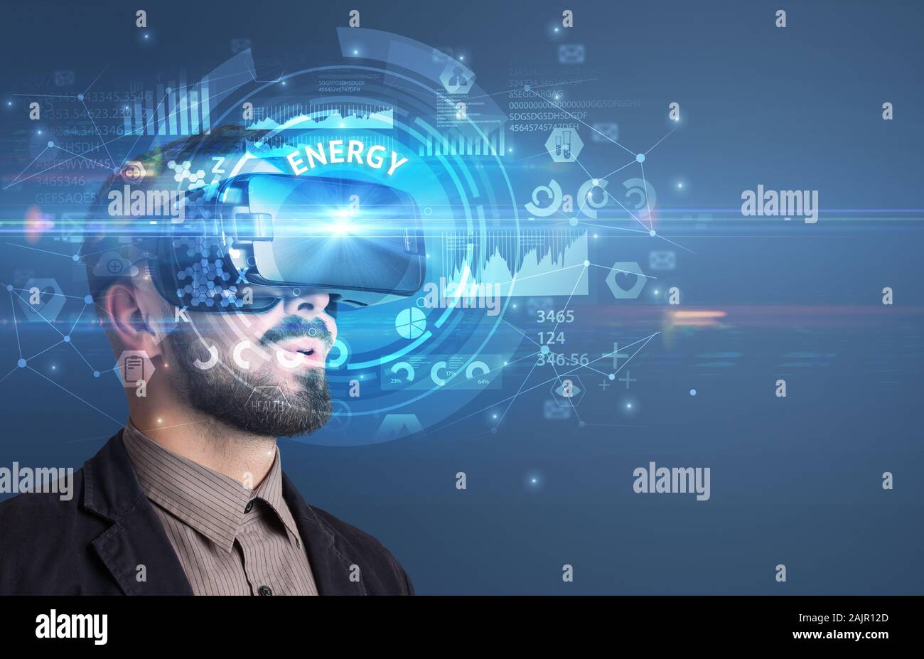 Businessman looking through Virtual Reality glasses with ENERGY ...