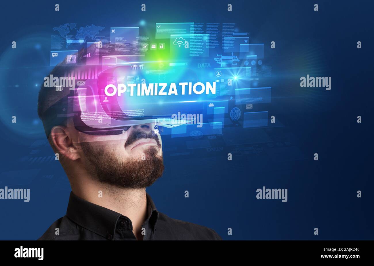 Businessman looking through Virtual Reality glasses with OPTIMIZATION ...