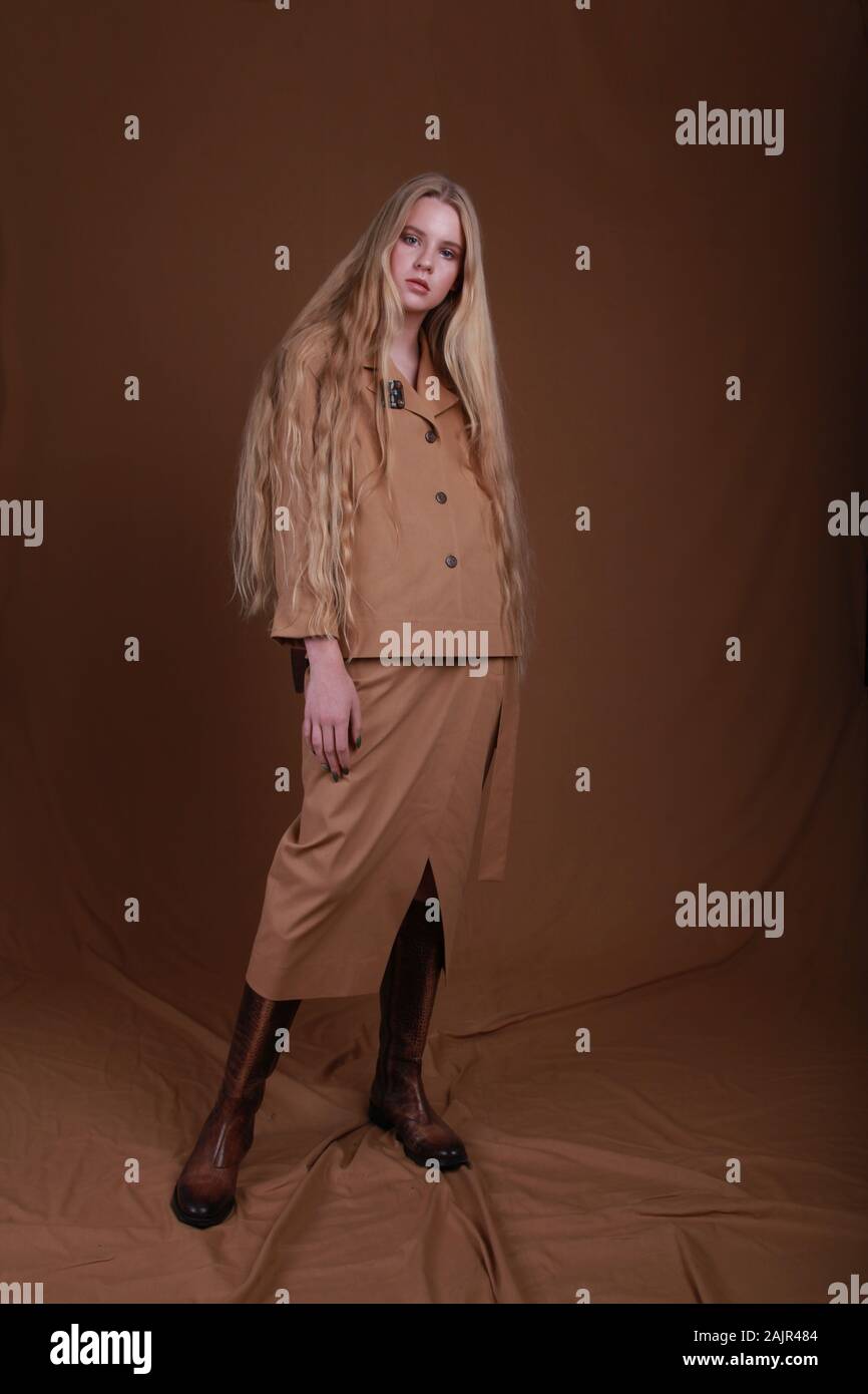Fashion shooting in studio . Professional teenage russian model , fashionable clothes and style, new collection. stylish look. beige total look Stock Photo