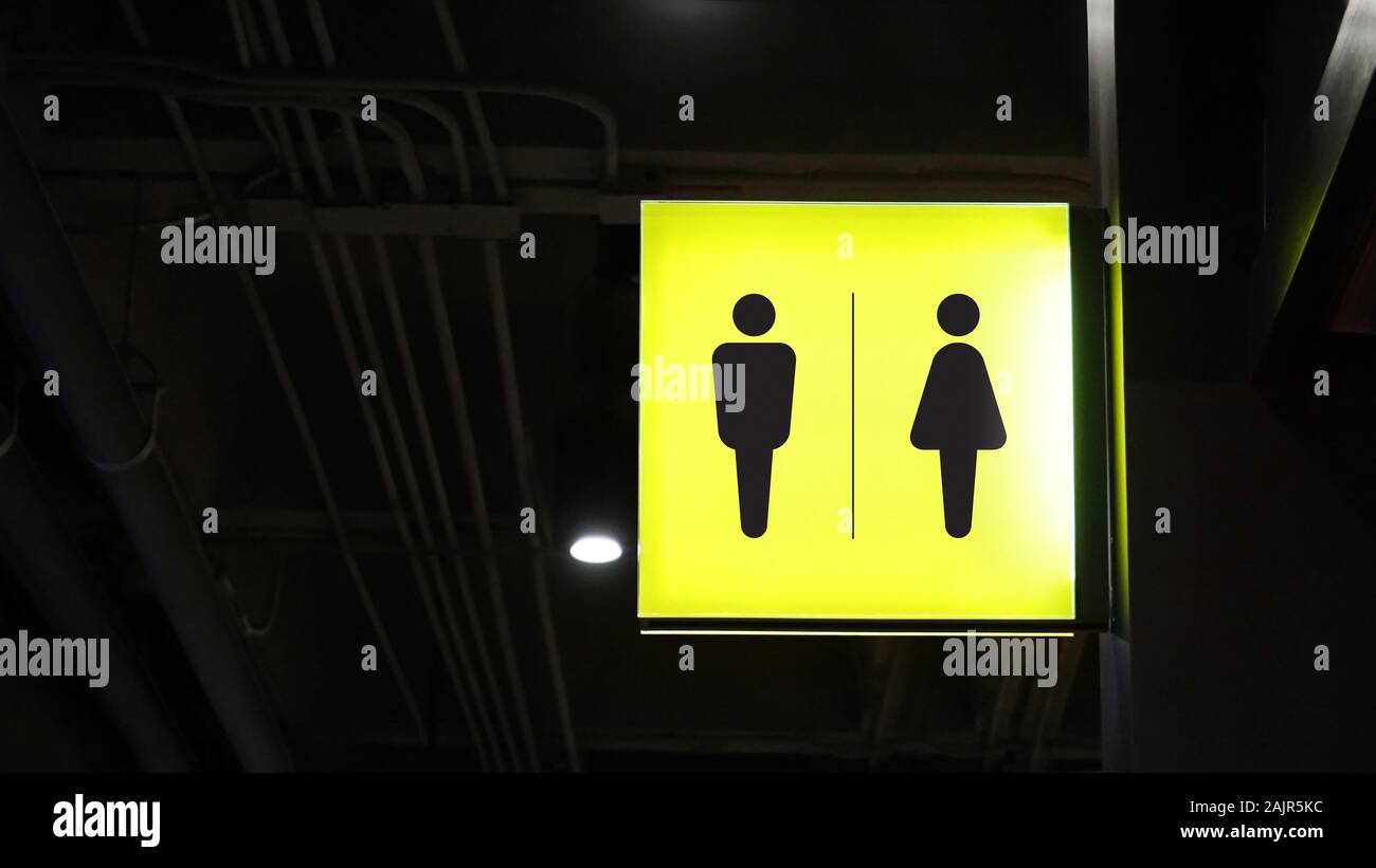 Square lightbox restroom signage hang on wall Stock Photo
