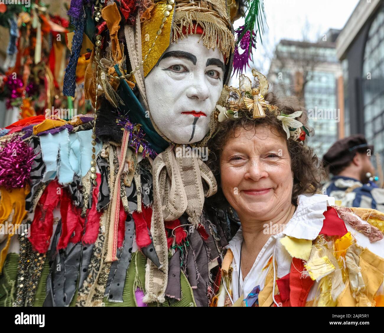 London, UK. 5th Jan 2020. The Lions players gather along the way before their performance. The 25th annual Twelfth Night Celebration, an ancient Midwinter custom, is held at Bankside, performed by 'The Lions part' players. The Holly Man, decked in green foliage, is piped over the River Thames. He is joined by the London Mummers, to toast (wassail) the people, and perform freestyle folk combat play in colourful costumes. The procession moves across the river, to Shakespeare's Globe and on to the St George Inn, Southwark. Credit: Imageplotter/Alamy Live News Stock Photo