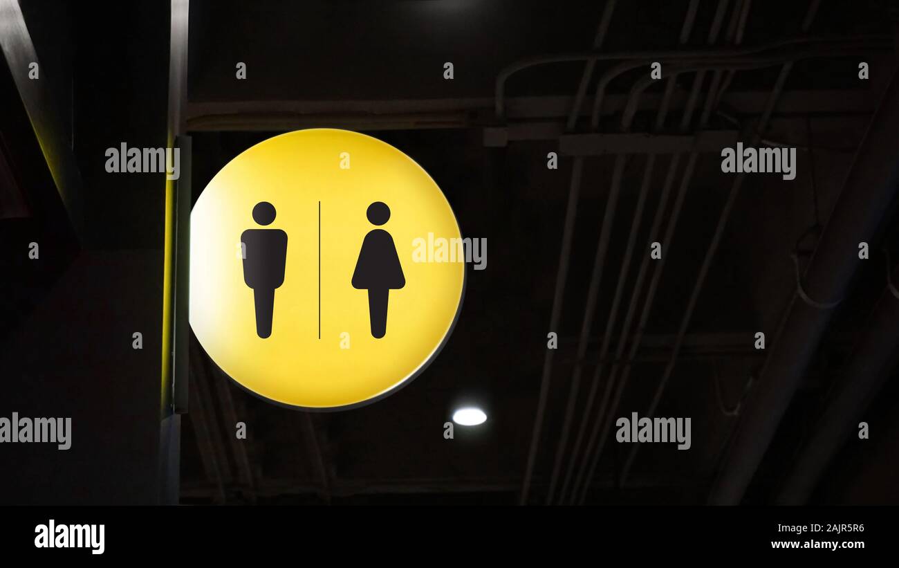 Circle lightbox restroom signage hang on wall Stock Photo