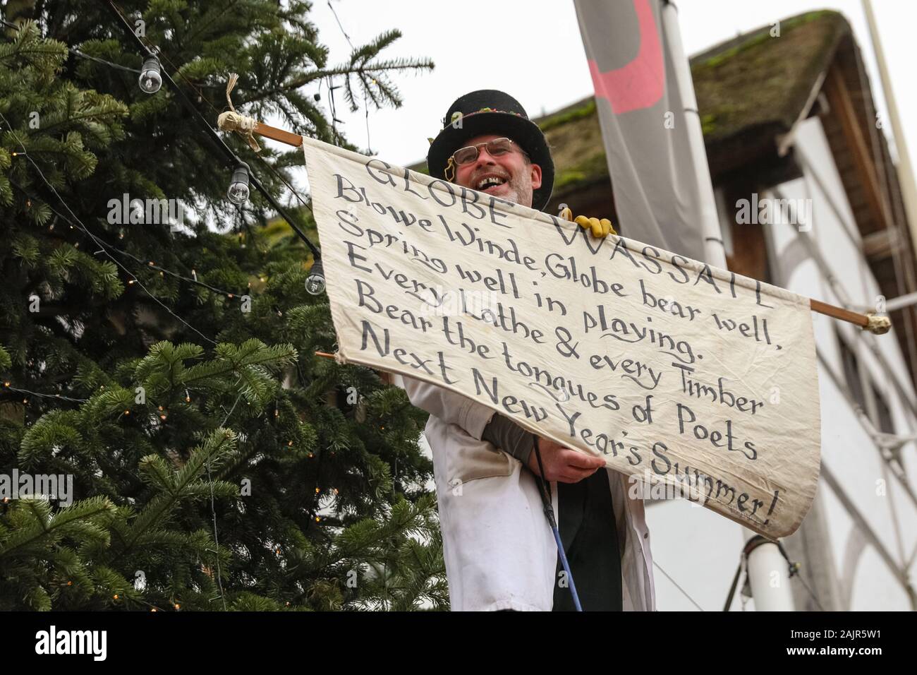 London, UK. 5th Jan 2020. The 25th annual Twelfth Night Celebration, an ancient Midwinter custom, is held at Bankside, performed by 'The Lions part' players. The Holly Man, decked in green foliage, is piped over the River Thames. He is joined by the London Mummers, to toast (wassail) the people, and perform freestyle folk combat play in colourful costumes. The procession moves across the river, to Shakespeare's Globe and on to the St George Inn, Southwark. Credit: Imageplotter/Alamy Live News Stock Photo