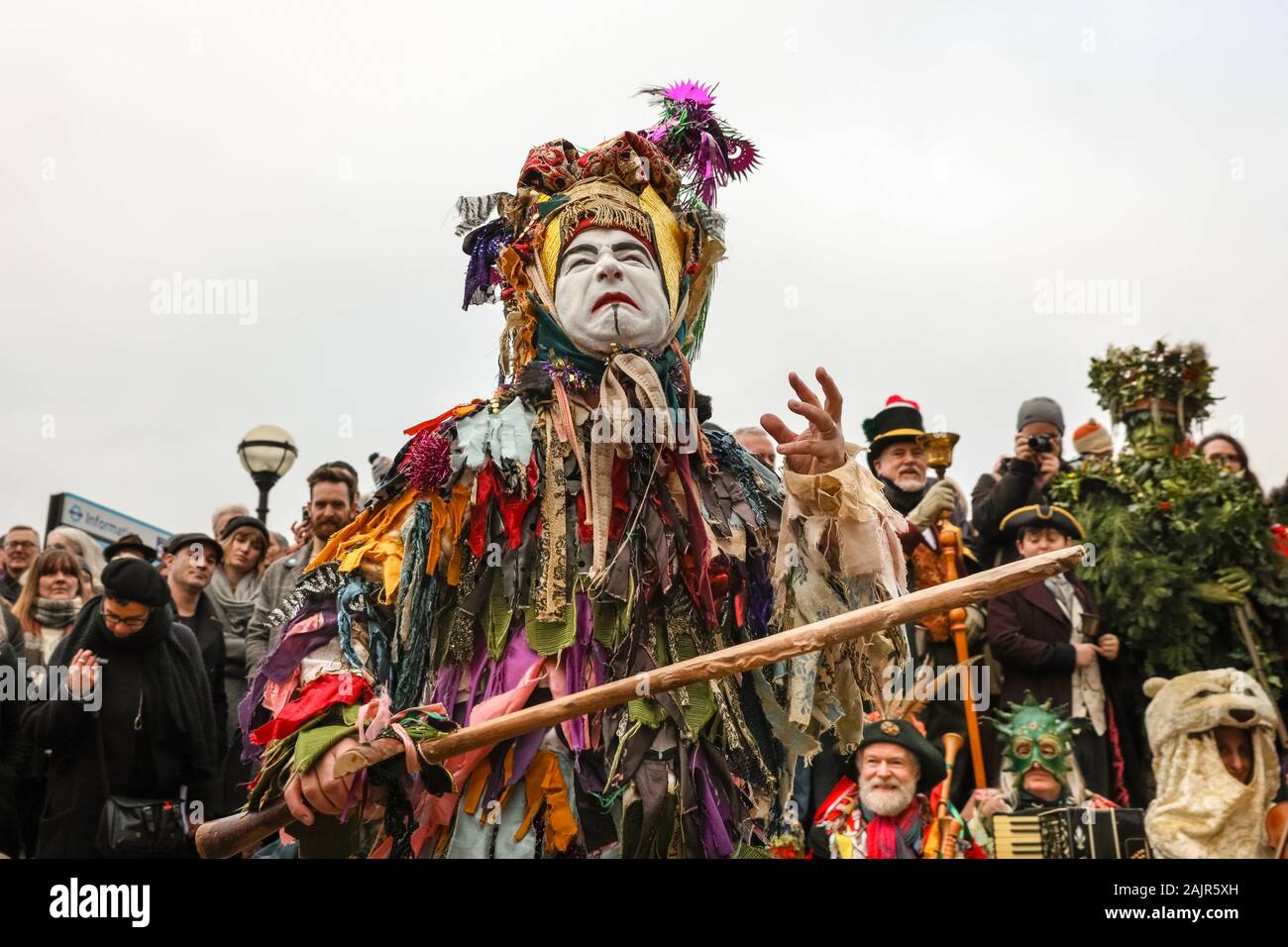 London, UK. 5th Jan 2020. The Mummers perform the traditional 'freestyle' St. George Folk Combat Play. The 25th annual Twelfth Night Celebration, an ancient Midwinter custom, is held at Bankside, performed by 'The Lions part' players. The Holly Man, decked in green foliage, is piped over the River Thames. He is joined by the London Mummers, to toast (wassail) the people, and perform freestyle folk combat play in colourful costumes. The procession moves across the river, to Shakespeare's Globe and on to the St George Inn, Southwark. Credit: Imageplotter/Alamy Live News Stock Photo