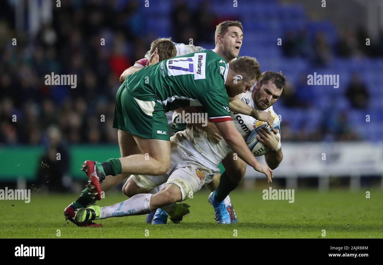 Exeter Chiefs Don Armand is tackled by London Irish Harry Elrington and Bryce Campbell during the Gallagher Premiership match at the Madejski Stadium, Reading. Stock Photo