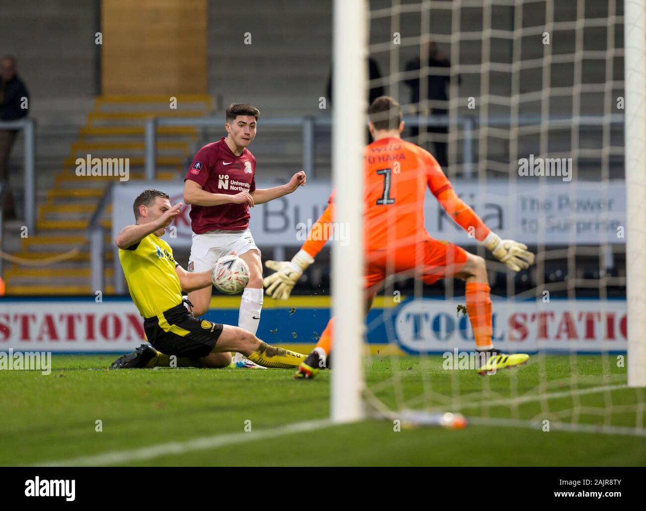 Burton Upon Trent, UK. 05th Jan, 2020.  Burton Albion versus Northampton Town; Scott Pollock of Northampton Town  takes a shot past Jake Buxton of Burton Albion and Goalkeeper Kieran O'Hara but the ball goes wide - Strictly Editorial Use Only. No use with unauthorized audio, video, data, fixture lists, club/league logos or 'live' services. Online in-match use limited to 120 images, no video emulation. No use in betting, games or single club/league/player publications Credit: Action Plus Sports Images/Alamy Live News Stock Photo