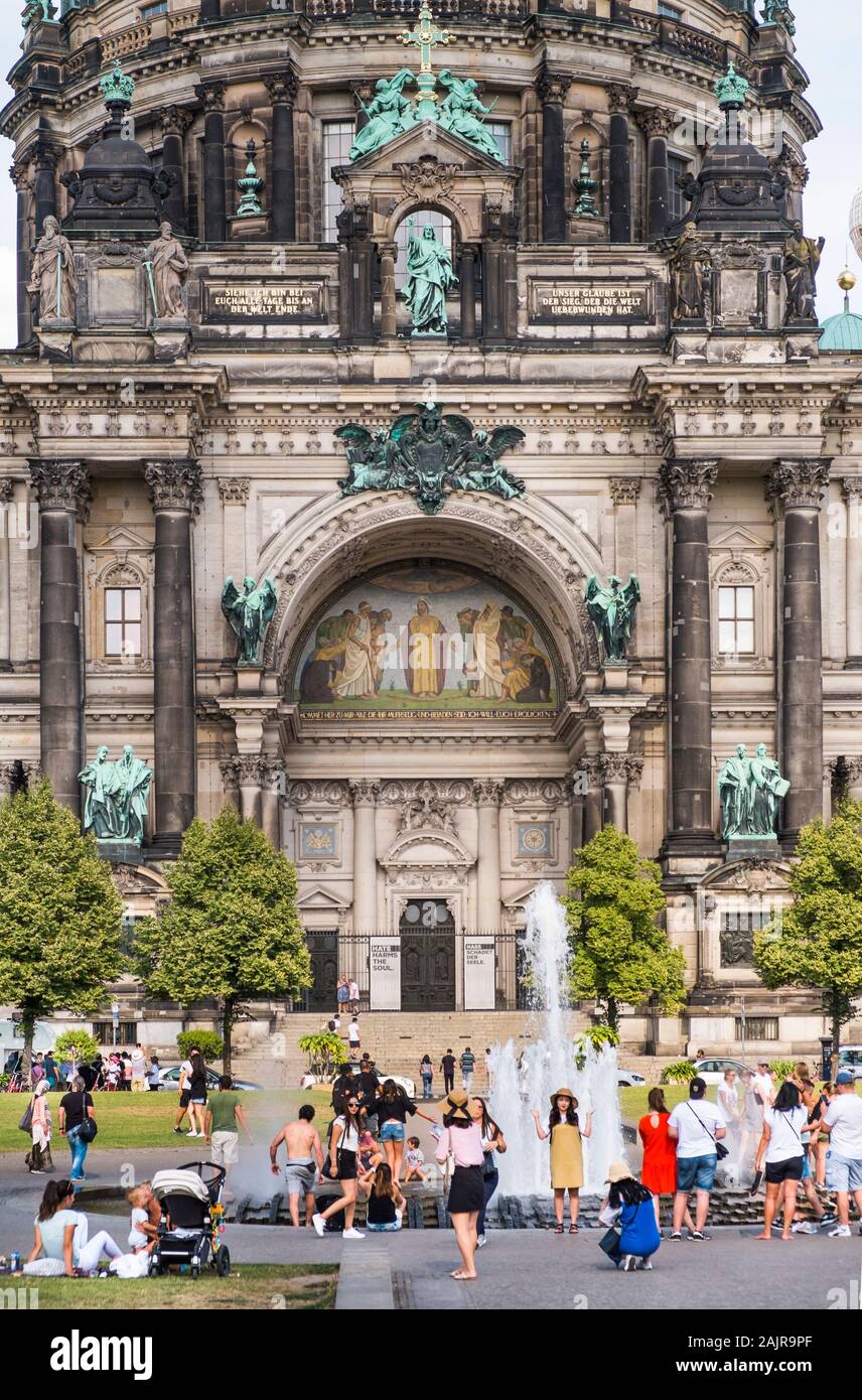 asian tourists posing in front of berlin cathedral Stock Photo