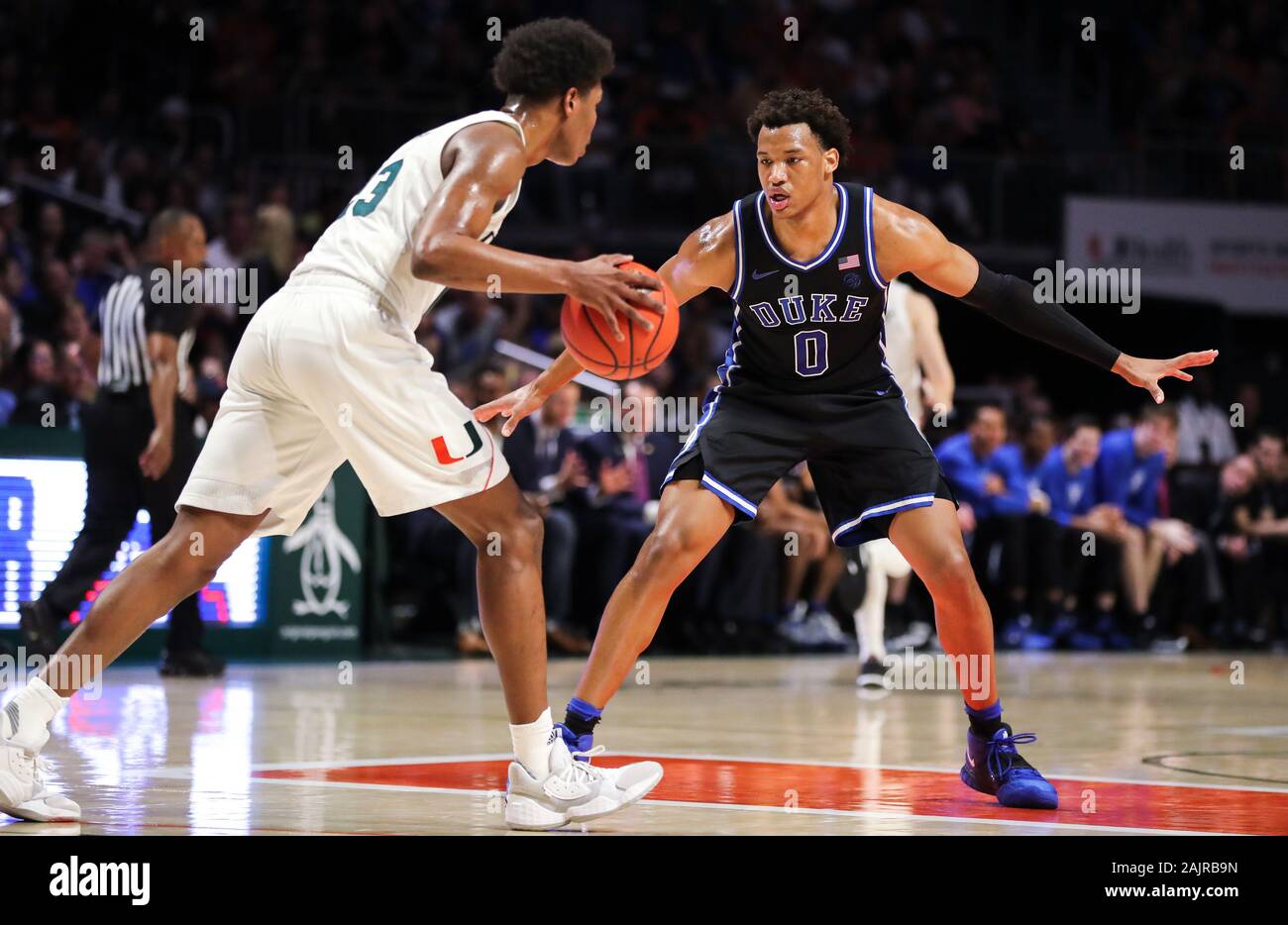 January 04, 2020: [Kameron McGusty] moves the ball defended by Duke Blue Devils forward Wendell Moore Jr. (0) during the first half of an NCAA men's basketball game at the Watsco Center in Coral Gables, Florida. Mario Houben/CSM Stock Photo
