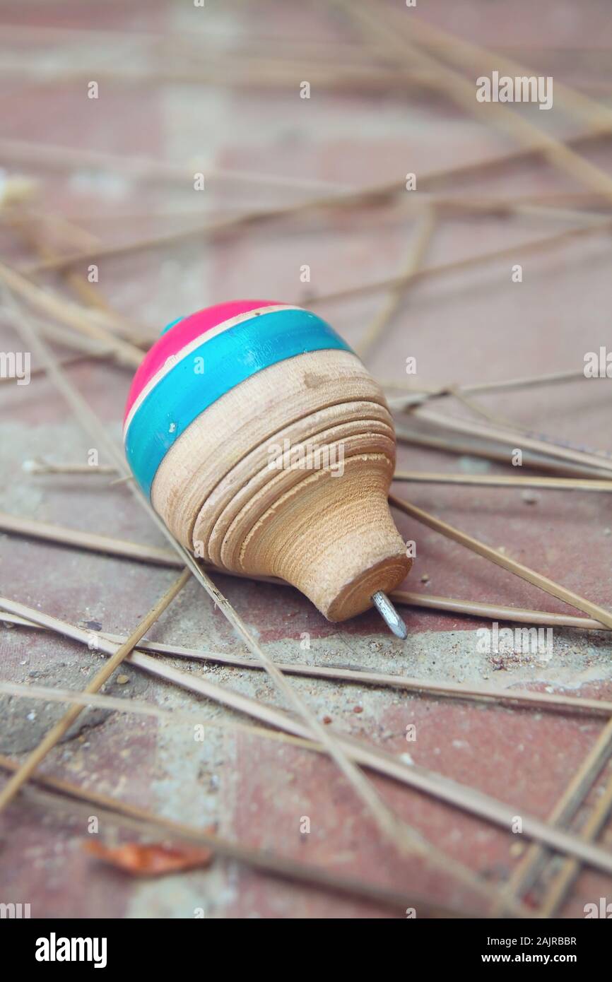 Classic wooden spinning top toy with string Stock Photo Alamy
