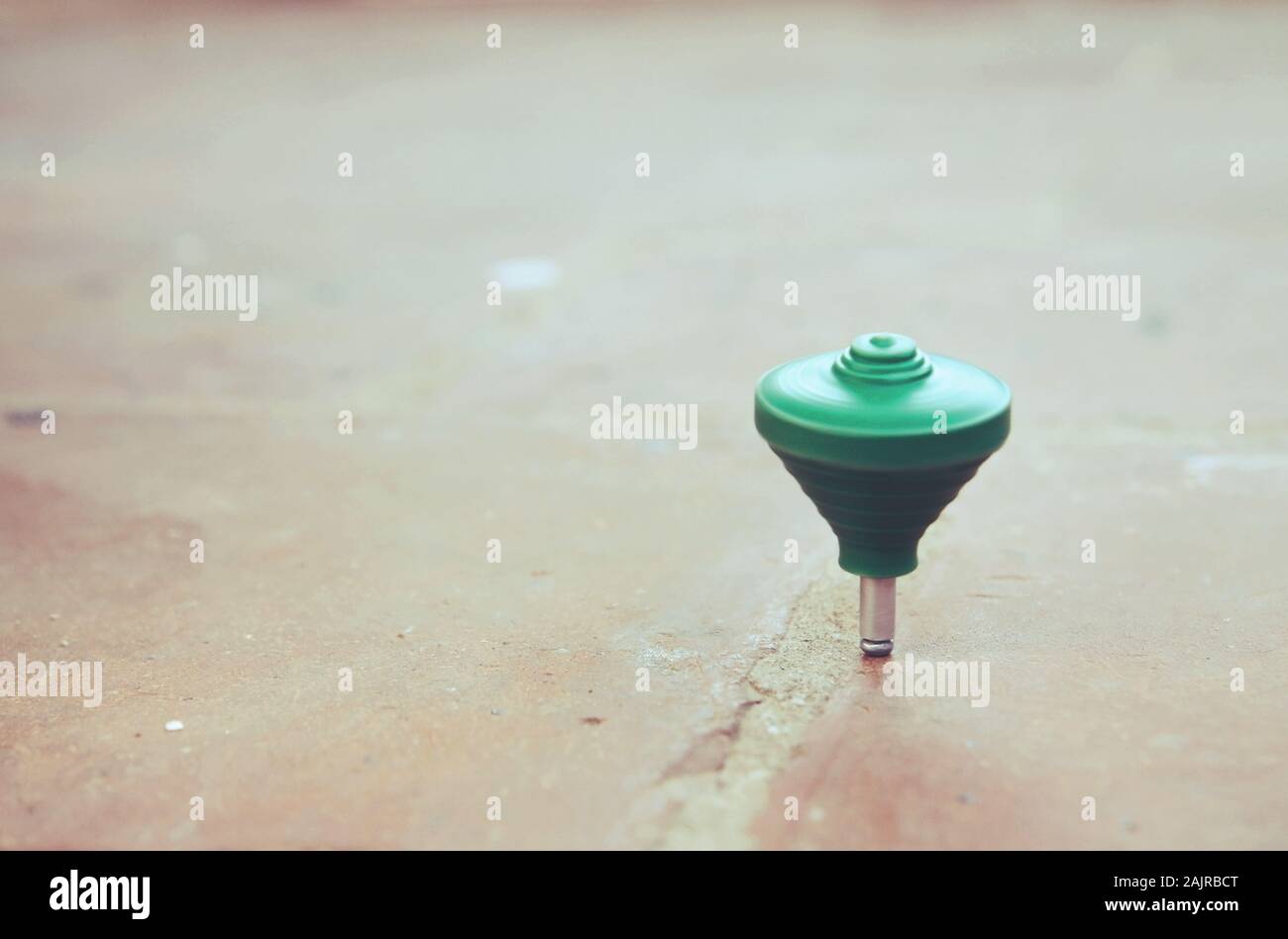 Classic plastic spinning top toy with string Stock Photo Alamy