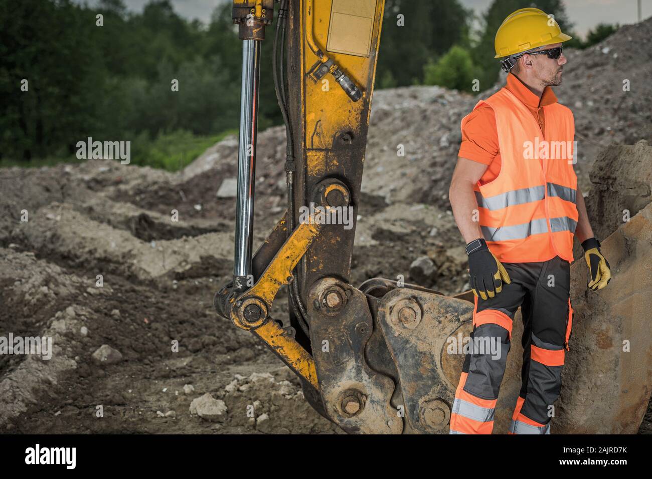 Ground Works Supervisor. Caucasian Excavator Operator Wearing Safety
