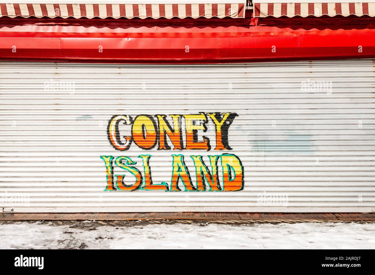 Coney Island graffiti spray painted on a metal roller shutter at Coney Island, Brooklyn, New York, United States Stock Photo