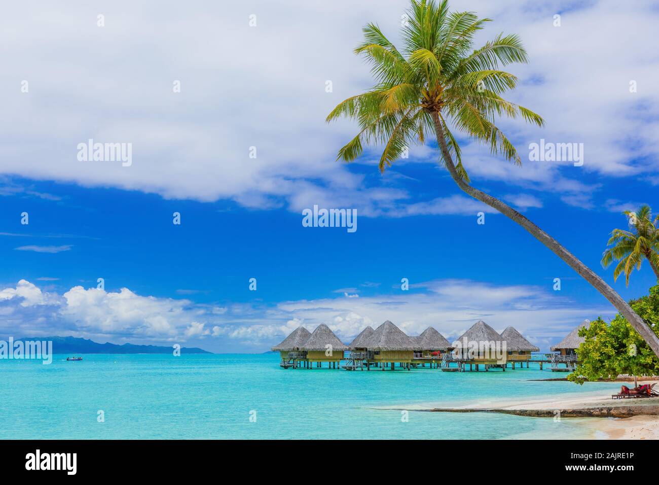 Over-water bungalows of tropical resort, Bora Bora island, near Tahiti, French Polynesia. Stock Photo