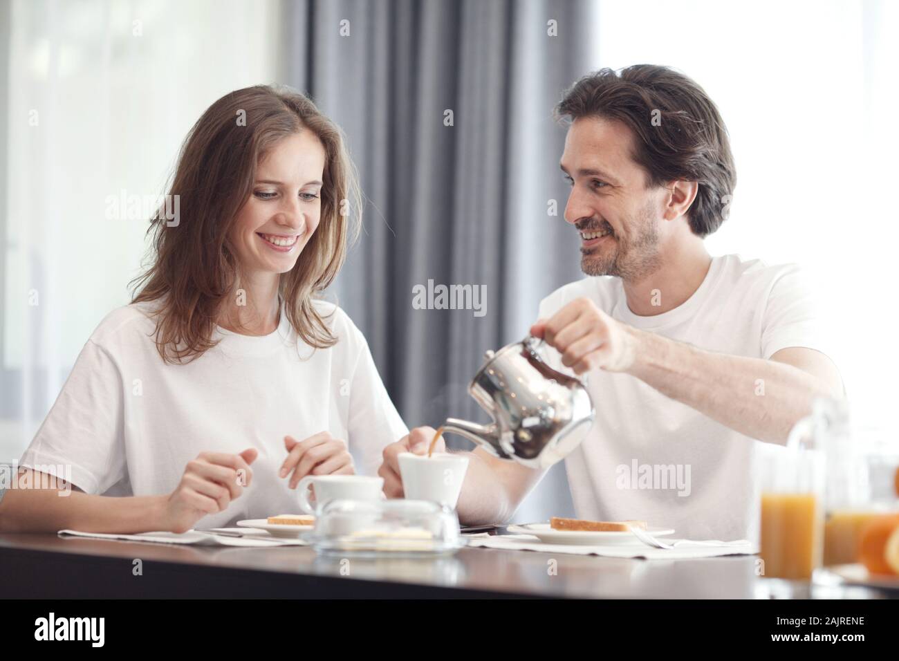 Young couple having positive hi-res stock photography and images - Alamy