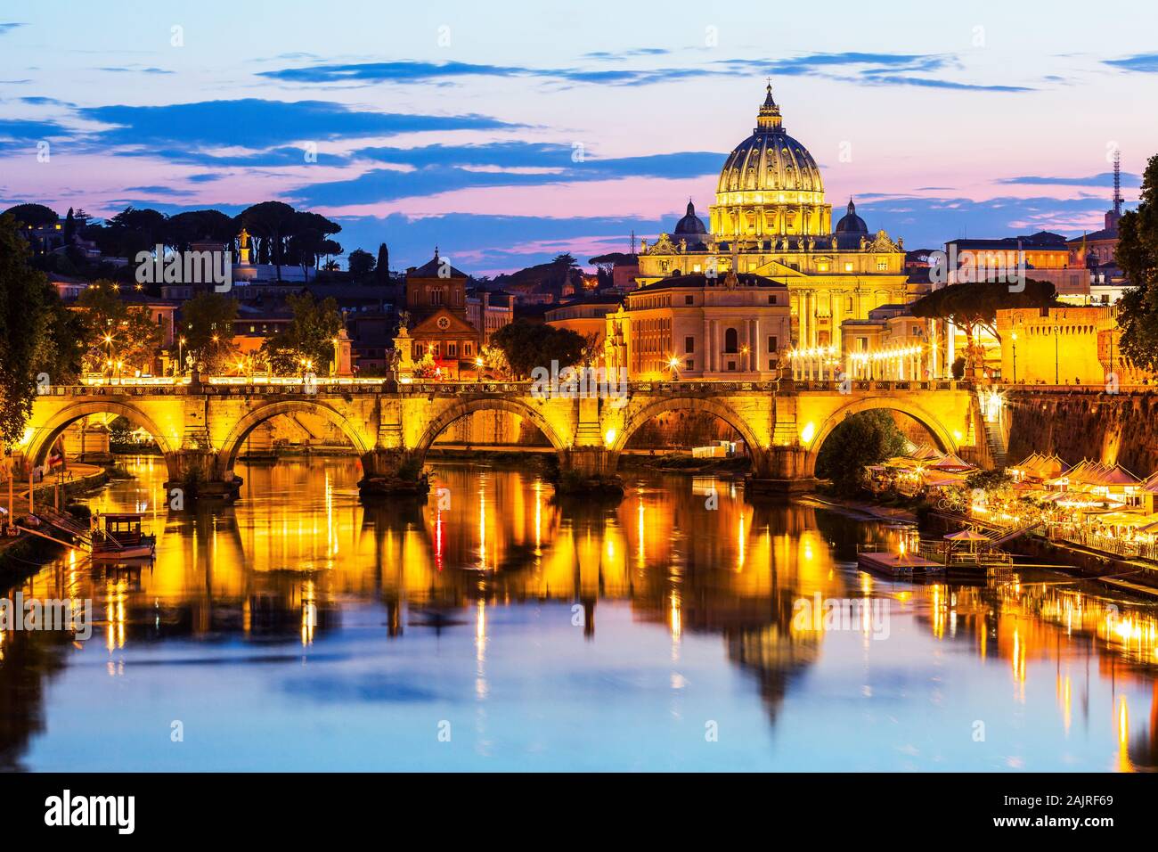 Rome, Italy. Saint Peter Basilica and Sant'Angelo Bridge, over Tiber river. Vatican City. Stock Photo
