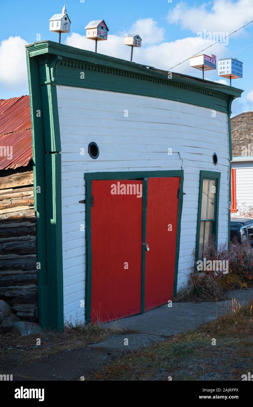 Old Log Garage and Bird Houses, Carcross, Yukon Stock Photo