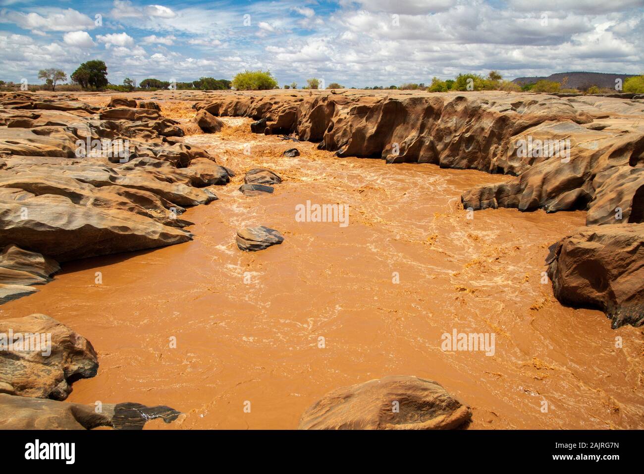 Galana river in Kenya, blue sky with clouds Stock Photo