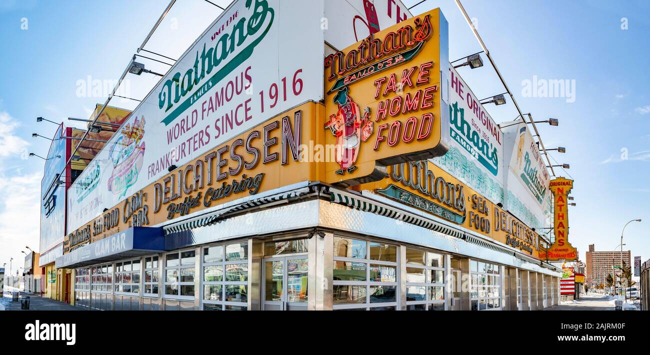 panorama shot of Neon signs at Nathans famous delicatessen at Coney Island, Brooklyn, New York, United States Stock Photo