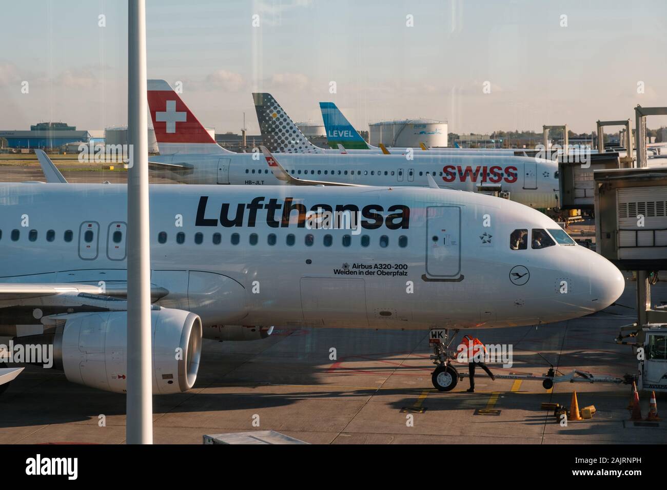 Amsterdam, Netherland - December, 2019: Lufthansa airplane and other airlines on airport in Amsterdam Stock Photo