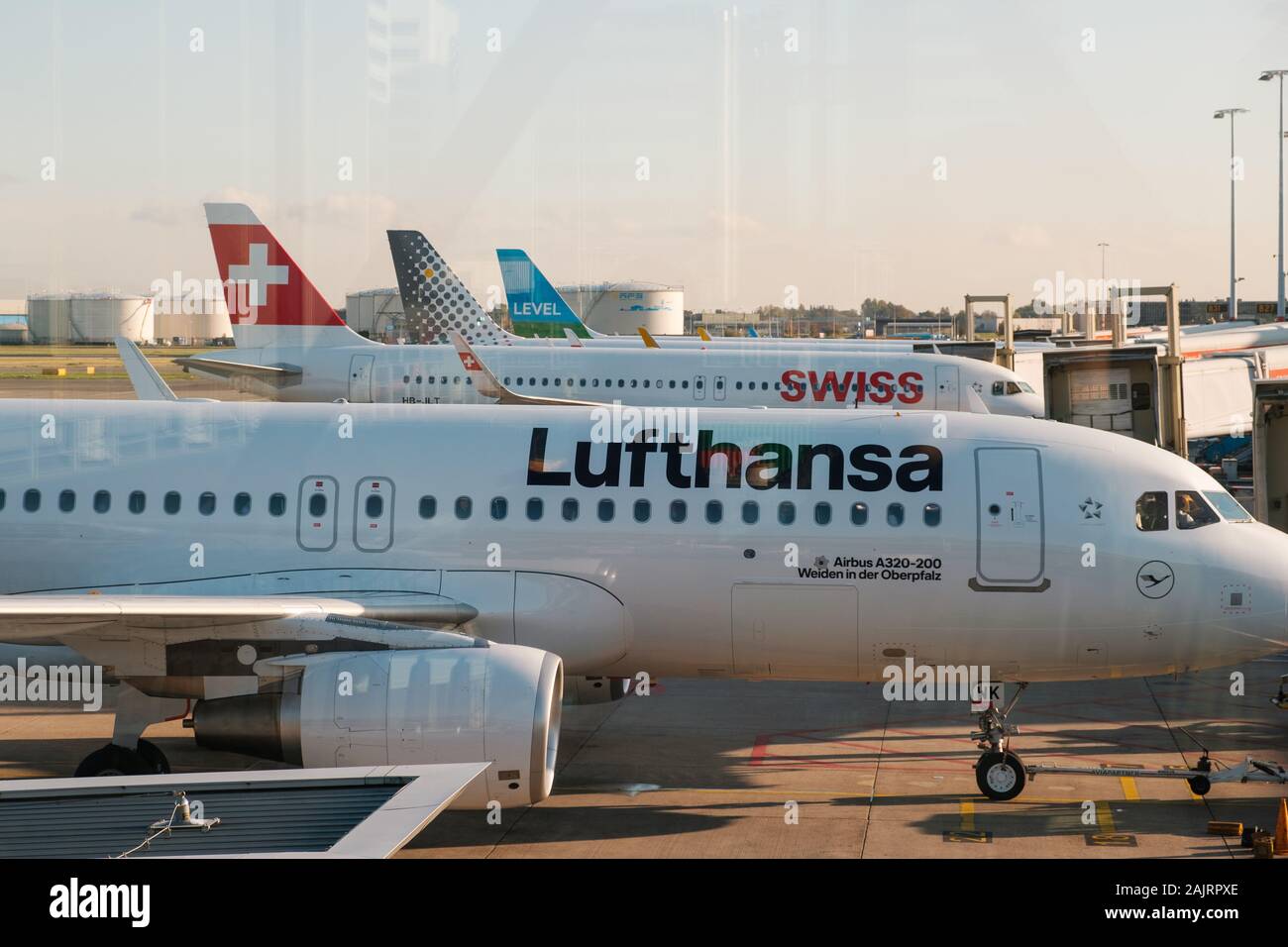Amsterdam, Netherland - December, 2019: Lufthansa airplane and other airlines on airport in Amsterdam Stock Photo