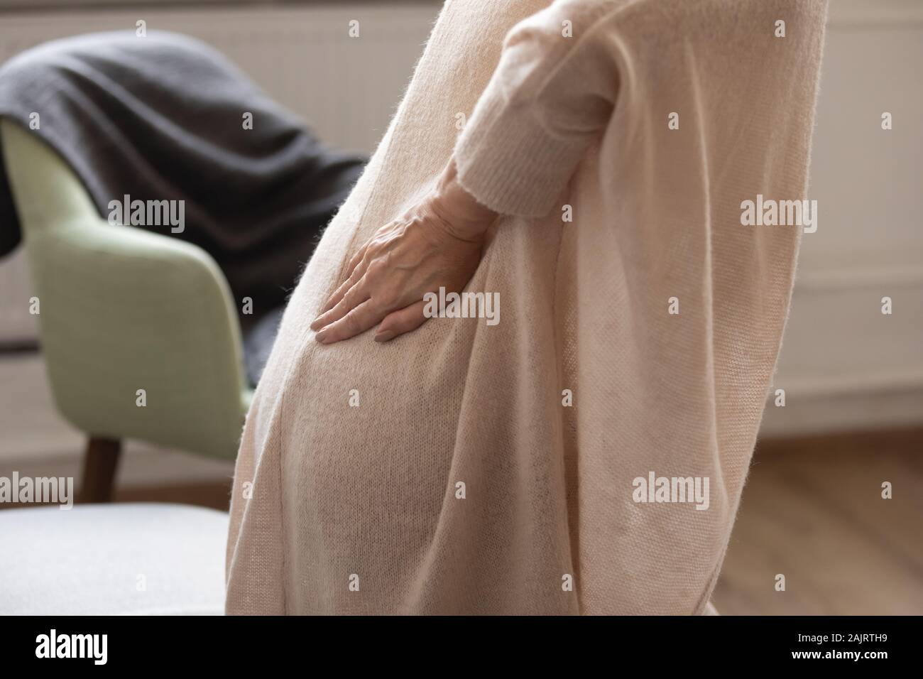 Close up of sick old woman having sudden backache Stock Photo