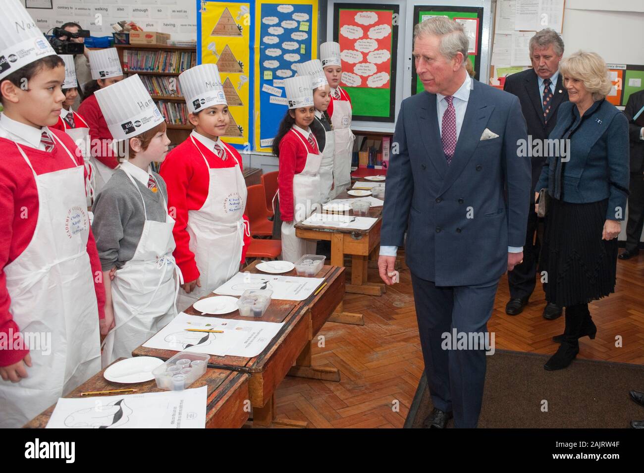 The Prince of Wales and the Duchess of Cornwall attending the launch of 'chefs adopt a school' programme at St George's primary school in Mayfair. Stock Photo