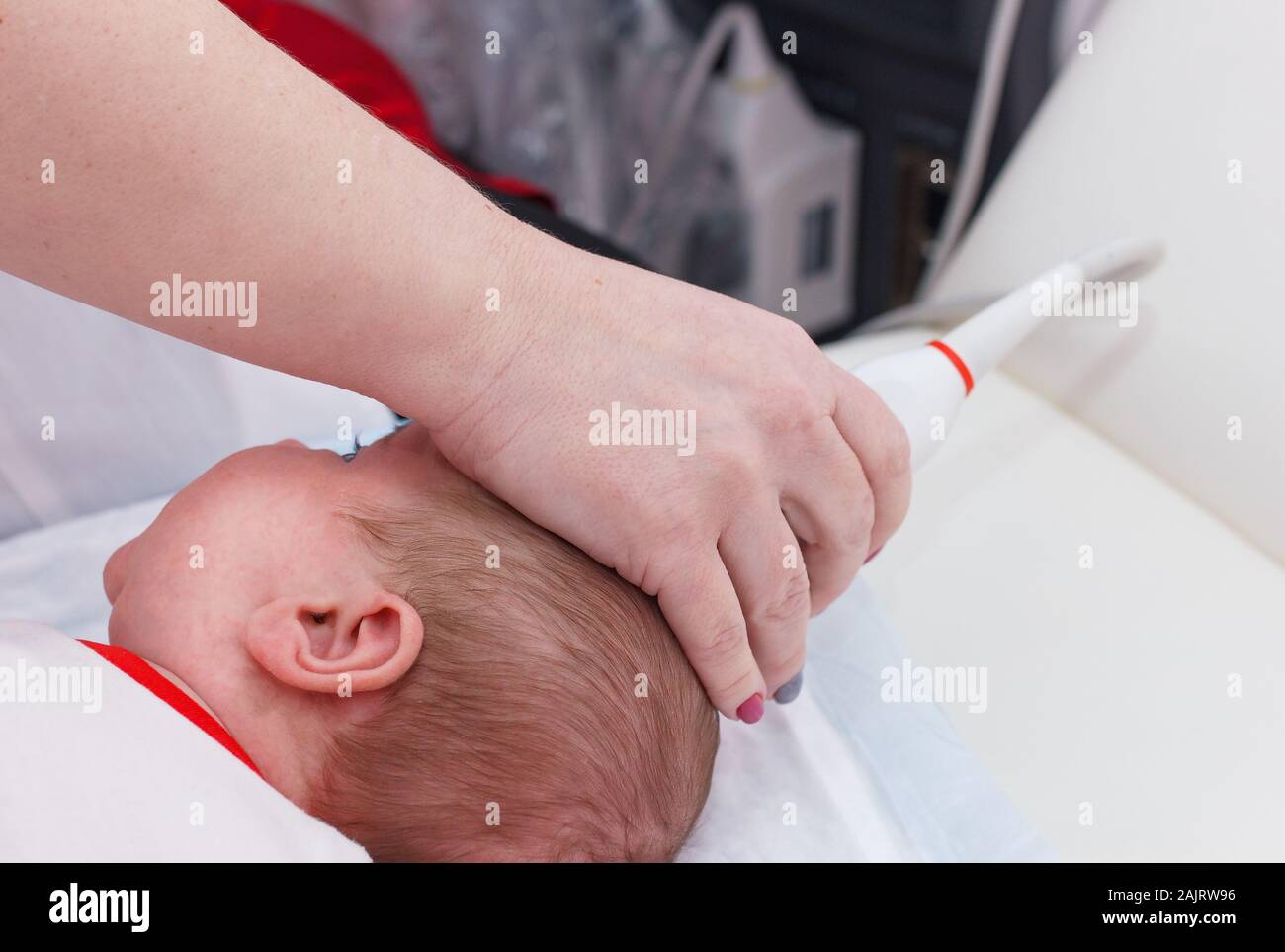 Ultrasound examination of the head. Examination of a month old baby Stock Photo